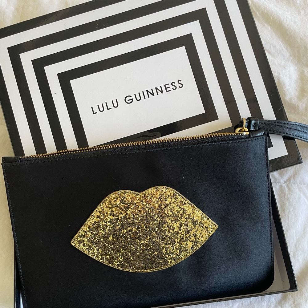 Lulu Guinness black satin pouch with gold glitter lip logo and wrist strap